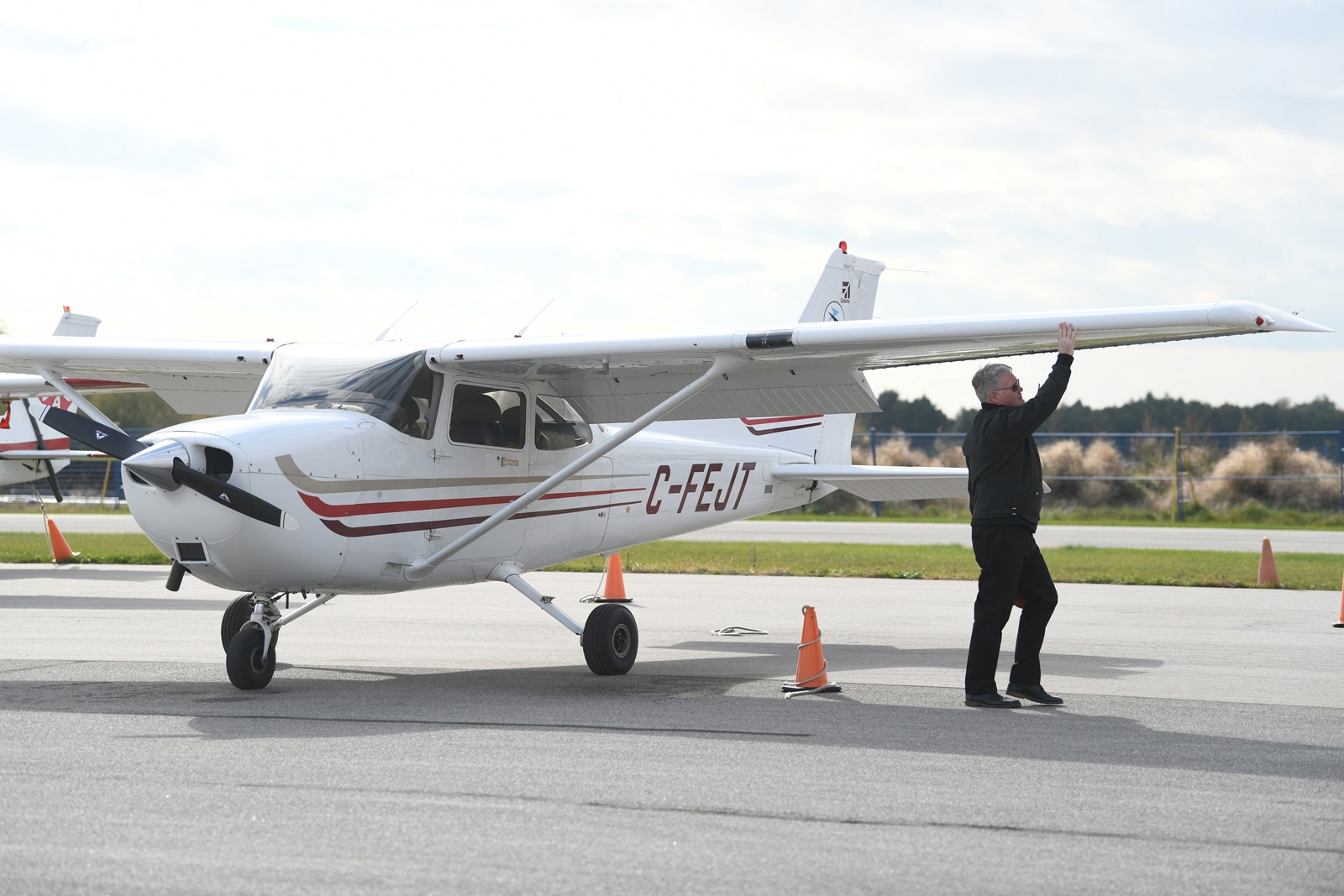 Pilot Mike Delaney completed his walk around before a flight from the Oshawa airport on Oct. 25. There is a looming shortage of pilots for the aviation industry.