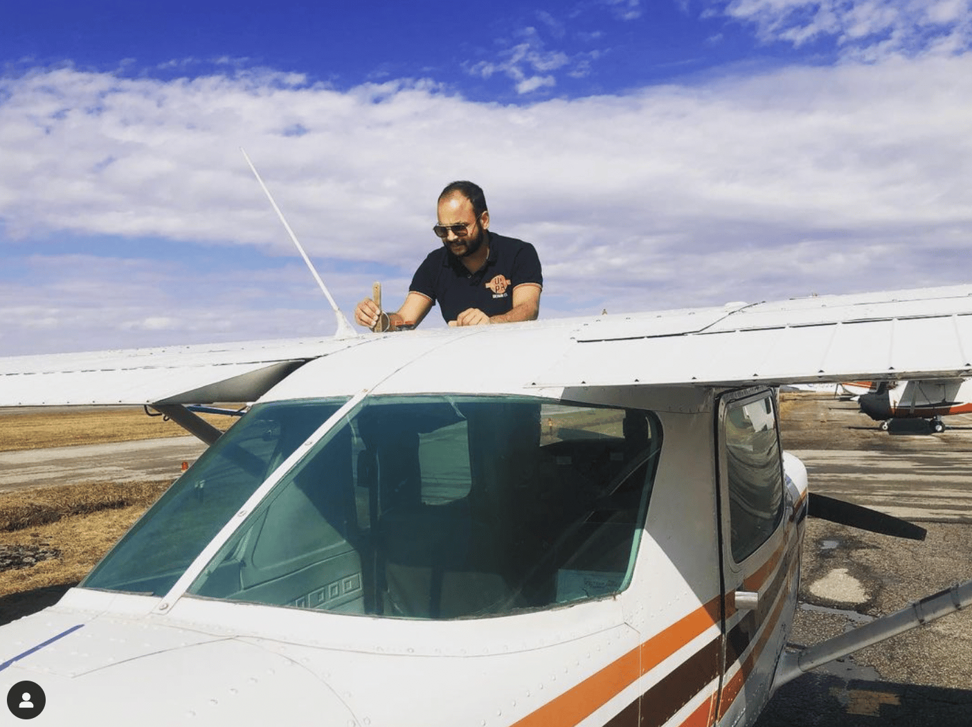 Student does a walk around and fuel inspection of a Spectrum Airways aircraft.